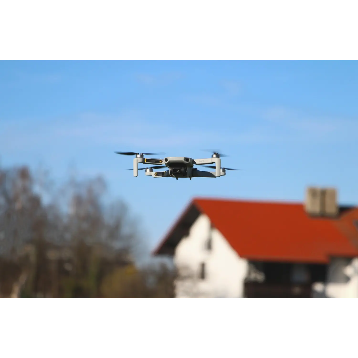 Drone capturing high-resolution roof images for accurate home inspection reports.